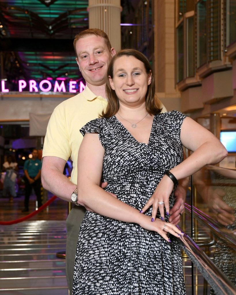 Photo of Dan and his wife leaned against a railing